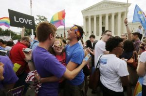 Gay rights supporters celebrate after the U.S. Supreme Court ruled that the U.S. Constitution provides same-sex couples the right to marry, outside the Supreme Court building in Washington, June 26, 2015. REUTERS/Jim Bourg