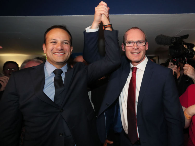 Simon Coveney (right) congratulates Leo Varadkar as he is named as Ireland's next prime minister after the votes for the leadership of the Fine Gael party were counted in the Mansion House in Dublin.