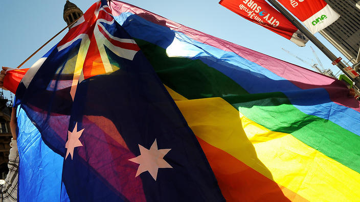 A protester shows his colours during a gay rights march through Sydney to the ruling Labor Party's conference to stage a mass "illegal wedding" stunt on August 1, 2009. The national Labor conference voted to develop a system for the registration and recognition of same-sex relationships, after gay rights advocates failed to gather enough numbers for a resolution to legalise gay marriage. Australian Prime Minister Kevin Rudd won the 2007 election on a platform that supported the former conservative government's legal definition of marriage as a union between a man and a woman.  AFP PHOTO/Torsten BLACKWOOD (Photo credit should read TORSTEN BLACKWOOD/AFP/Getty Images)